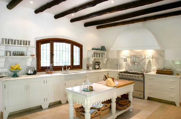 Kitchen interior of large spanish villa. With wooden rafters on