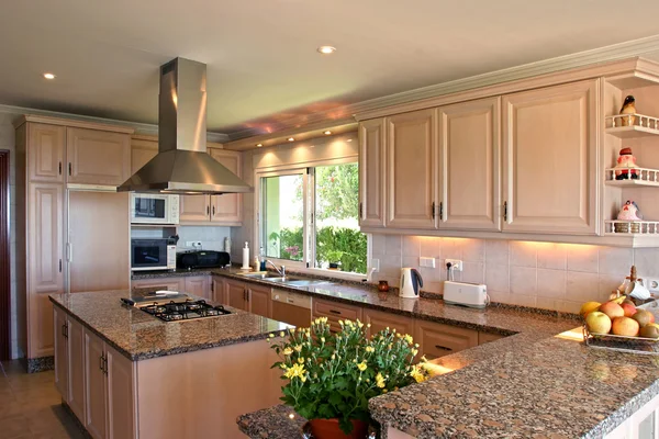 Kitchen interior of large spanish villa. With fresh flowers and