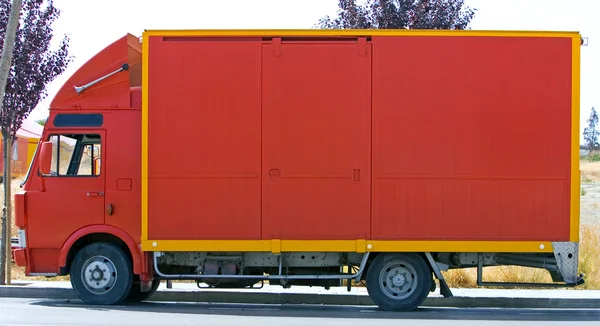 Plain red lorry or van side view