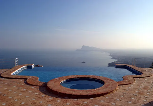 Luxury infinity swimming pool in villa in spain with incredible