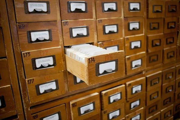 Database concept. vintage cabinet. library card or file catalog.