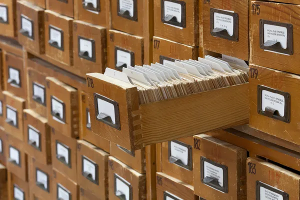 Database concept. vintage cabinet. library card or file catalog.