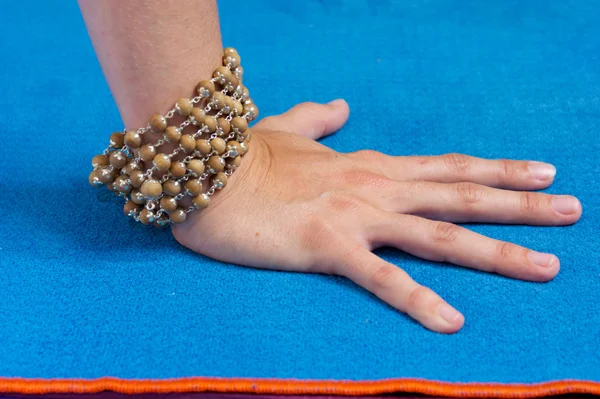 Close up of hand with mala beads
