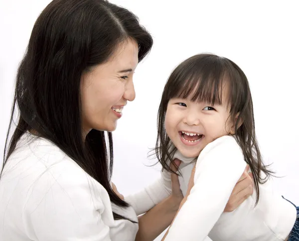 Happy mother and daughter with white background