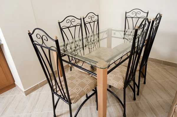 Large dining table and chairs in a house