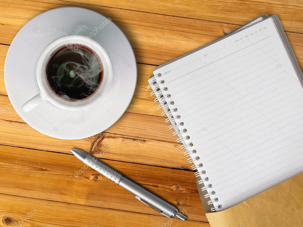 White cup of hot coffee and blank page note book - Stock Image