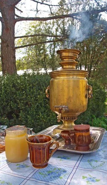 Traditional russian samovar and honey