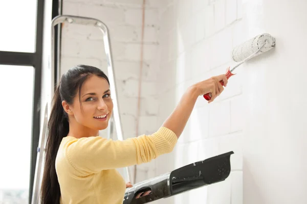 Lovely housewife painting — Stock Photo #5934214