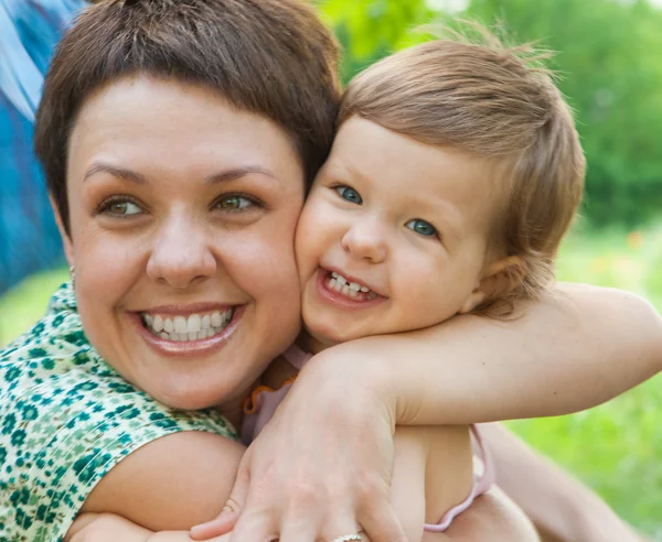 Child Hugging Mother