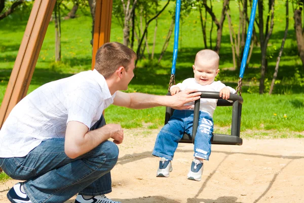 Father and son on the playground