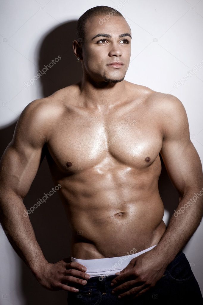 Strong wet sexy nude young bodybuilder posing | Stock Photo
