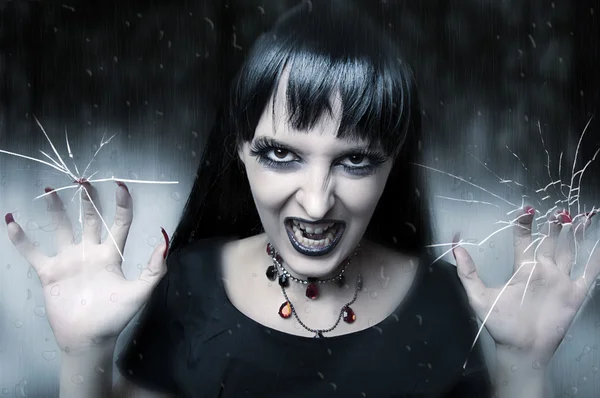 Horror and halloween concept. Female vampire