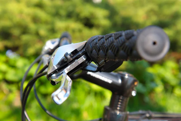 Outdoor shot of a sport bicycle control. Closeup.