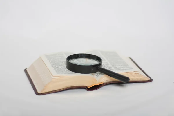 The Holy Bible and magnifier
