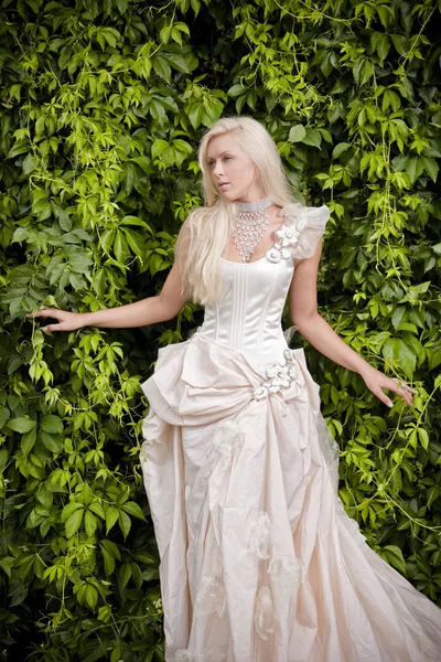 Blond bride in luxury clothes