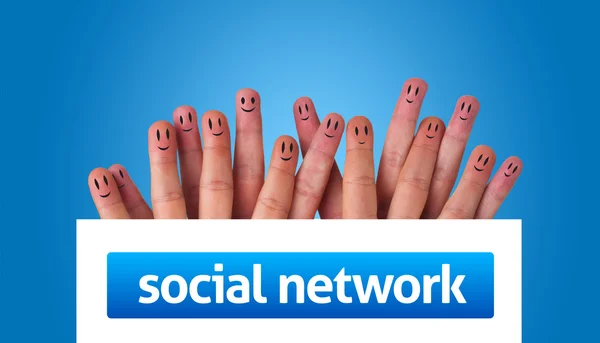 Group of finger smileys holding whiteboard with social network s