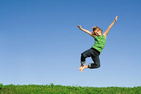 Fit healthy active happy smiling child, jumping for joy
