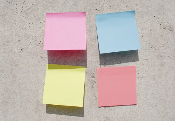 Sticky notes on the concrete wall