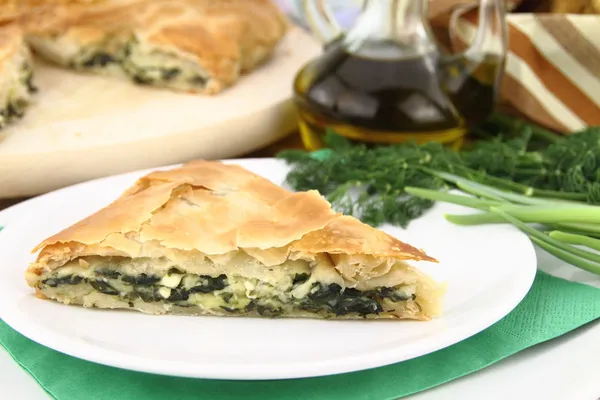 Homemade puff spinach pie with filo pastry