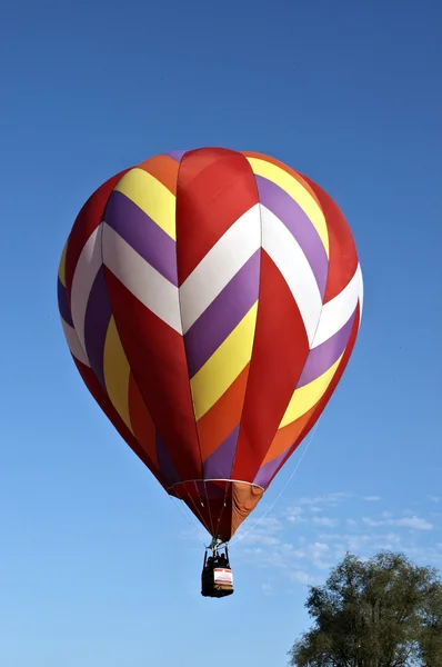 Hot air balloons with bright colors on a hot summer day