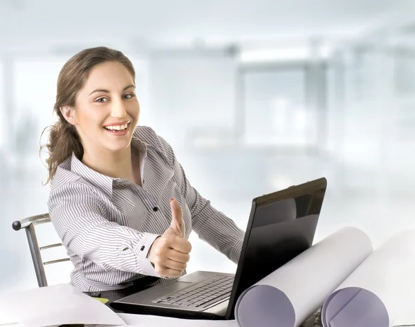Business woman giving thumbs-up-sign