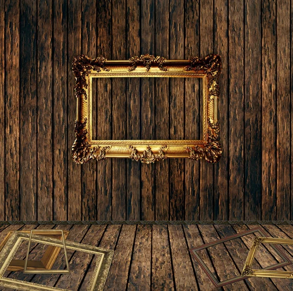 Antique gilded frame over wooden wall