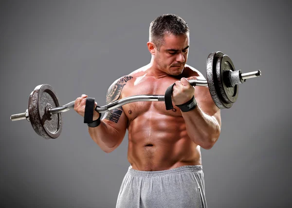 Bodybuilder lifting weights, closeup