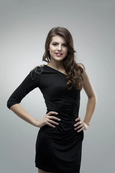 Tall woman posing black dress