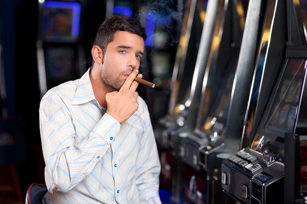 Casino player smoking cigar