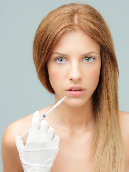Young woman injecting colagen in lips by Comaniciu Dan Dumitru Stock Photo Young woman injecting colagen in lips by Comaniciu Dan Dumitru Stock Photo