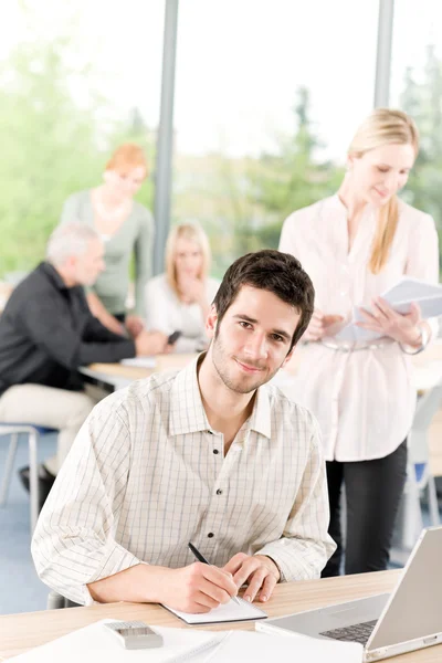 Young business students - businessman in front