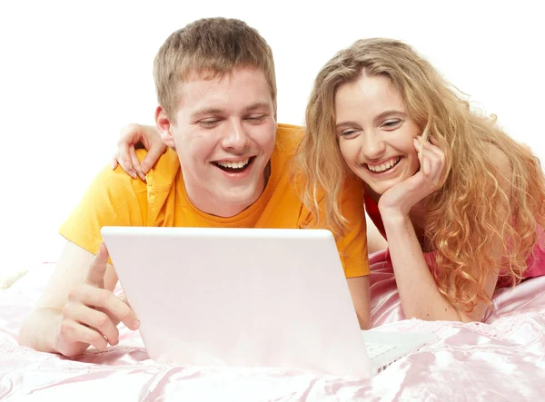 Young man and woman using a laptop