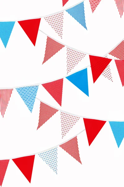 Red, blue and white flags on white background
