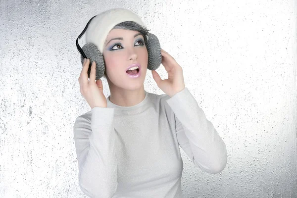 Futuristic fashion woman hearing music headphones