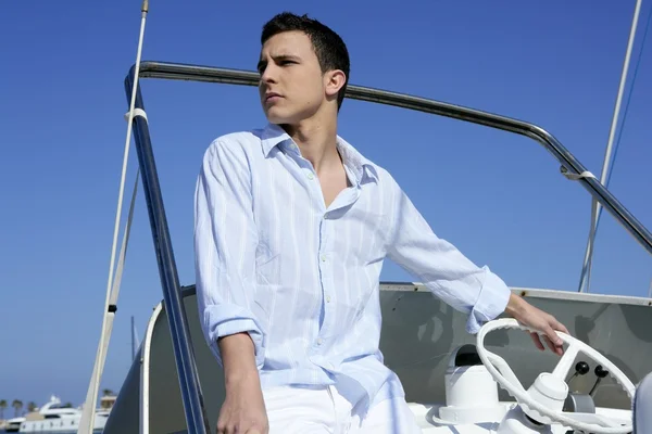 Handsome young man on boat, summer vacation