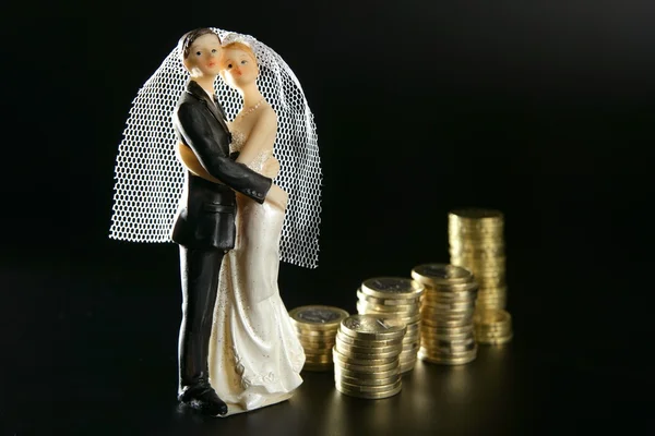Wedding couple figurine and golden coins