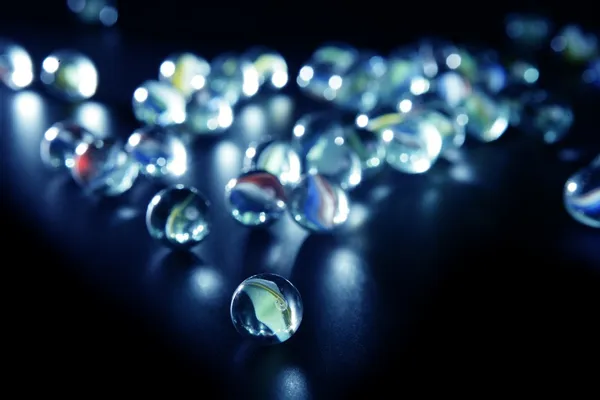 Glass marbles with blue reflections