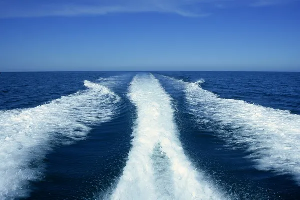 Boat white wake on the blue ocean sea