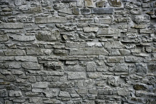 Antique grunge old gray stone wall masonry