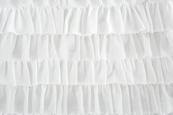 Pleated skirt fabric fashion in white closeup