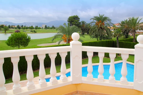 Golf course from pool housel white balustrade