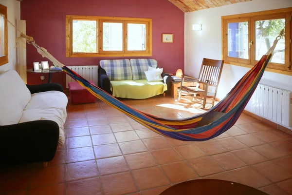 Living room in warm colors, mexican hammock — Stock Image © TONO ...