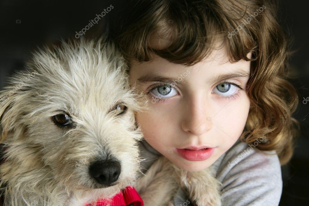 Dog puppy and girl hug portrait closeup blue eyes white hairy little doggy