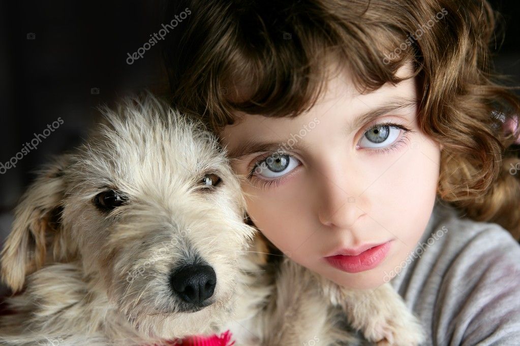Dog puppy and girl hug portrait closeup blue eyes white hairy little doggy