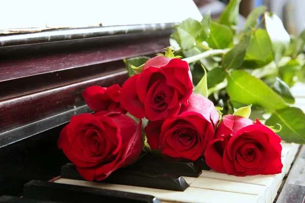 Classic red roses on piano vintage romantic valentines