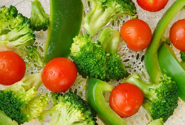 Steamed broccoli, cauliflower, and cherry tomato