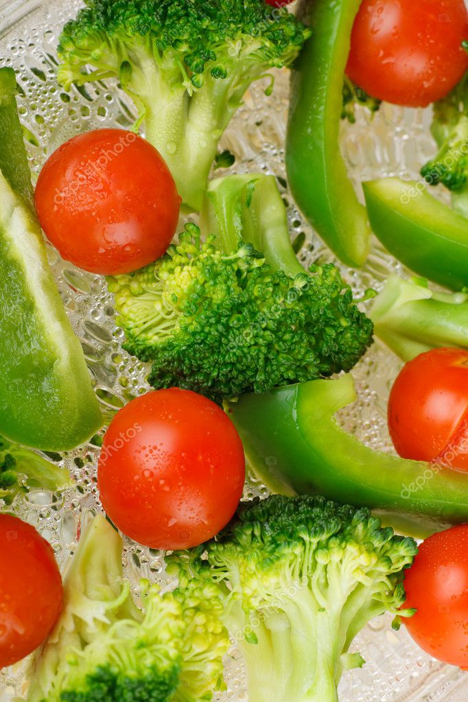 Tasty steamed vegetables with water drops on them — Stock Photo