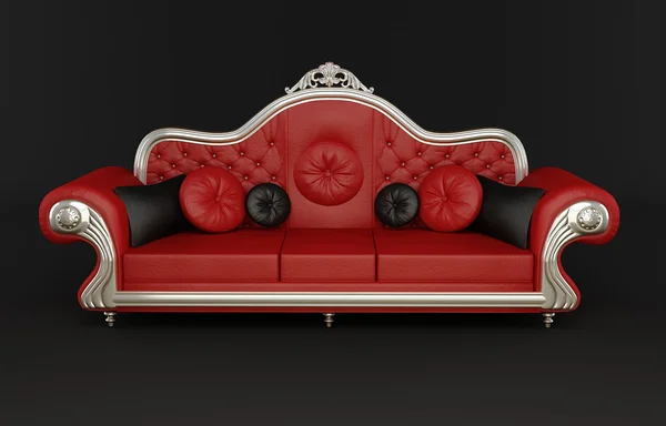 Red leather sofa with cushions