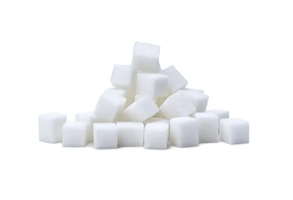 Random pile of sugar cubes on white