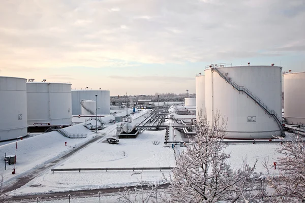 White tanks in tank farm with snow in winter